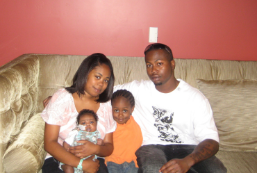 Family sitting on a couch