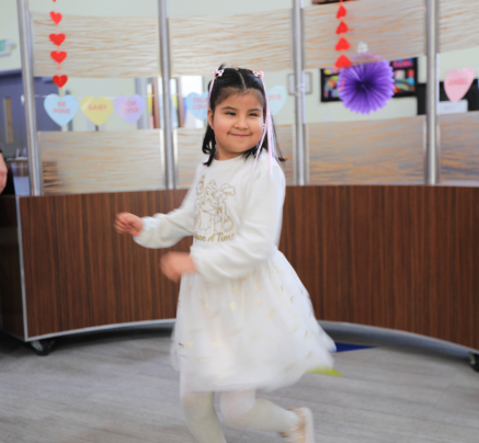 girl dancing and smiling