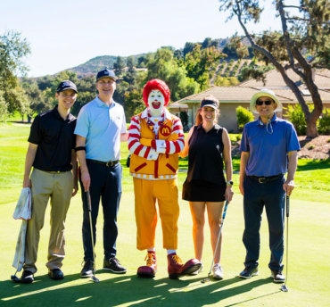 HME employees on the golf course with ronald