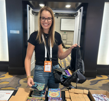Illumina employee filling a welcome bag