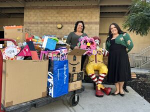 Volunteers dropping off donations for the Holiday Toy Drive