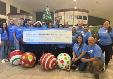 employees holding a check