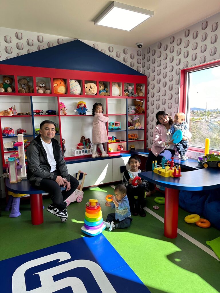 Family playing in Padres room